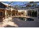 Exterior view of a screened-in pool with archways and the home's architecture in the background at 1695 Horseshoe Rd, Enterprise, FL 32725