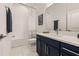 Well-lit bathroom with vanity, shower-tub, and modern fixtures at 1873 Flora Pass Pl, Kissimmee, FL 34747