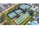 Aerial view of community featuring tennis and bocce ball courts, creating a social and active environment at 1873 Flora Pass Pl, Kissimmee, FL 34747