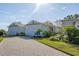 Charming single-story home with a brick paved driveway and manicured landscaping at 1873 Flora Pass Pl, Kissimmee, FL 34747