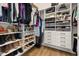 Well-organized walk-in closet with custom shelving, drawers, and ample storage space for clothing, shoes, and accessories at 1873 Flora Pass Pl, Kissimmee, FL 34747