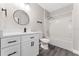 Bright bathroom features a modern vanity, new fixtures, and a shower-tub combo at 2040 Patriot Way, St Cloud, FL 34769