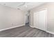 Bedroom featuring a ceiling fan, closet, and new flooring at 2040 Patriot Way, St Cloud, FL 34769