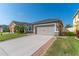 Charming single Gathering home featuring an attached two-car garage and a well-maintained lawn at 2040 Patriot Way, St Cloud, FL 34769