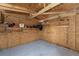 Inside of wooden storage shed showing plywood walls, shelves, and a light concrete floor at 2040 Patriot Way, St Cloud, FL 34769