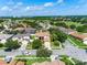 Aerial view of home showcasing neighborhood, landscaping, well maintained lawn, and overall curb appeal at 214 Farrington Ln, Kissimmee, FL 34744