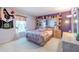 Charming bedroom with playful decor, a comfortable bed, and a bright, airy feel at 214 Farrington Ln, Kissimmee, FL 34744