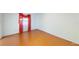 Empty bedroom showcasing hardwood floors and a window at 2416 Oak Mill Dr, Kissimmee, FL 34744