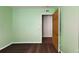 Bedroom showcasing a dark hardwood floor and a doorway at 2416 Oak Mill Dr, Kissimmee, FL 34744