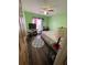 Bedroom showcasing the ceiling fan and window with patterned curtains at 2416 Oak Mill Dr, Kissimmee, FL 34744