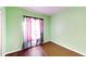 Bright bedroom showcasing hardwood floors and a window at 2416 Oak Mill Dr, Kissimmee, FL 34744