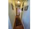 Hallway with several doors and decorations on the wall at 2416 Oak Mill Dr, Kissimmee, FL 34744