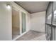 Enclosed balcony with sliding glass doors offering a view of the interior at 2416 Swailes Dr # 8, Orlando, FL 32837