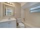 Bathroom featuring vanity, decorative mirror, and a shower-tub combination with neutral colors at 2416 Swailes Dr # 8, Orlando, FL 32837