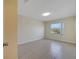 Bright bedroom with tile flooring, natural light, and a view of the neighborhood at 2416 Swailes Dr # 8, Orlando, FL 32837