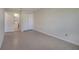 Bedroom with tile flooring, closet, and doorway leading to the bathroom at 2416 Swailes Dr # 8, Orlando, FL 32837