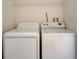 Practical laundry area with modern washing machine and dryer for convenience at 2416 Swailes Dr # 8, Orlando, FL 32837