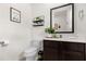 Modern bathroom with toilet, sink, and decor at 2634 Corvette Ln, Kissimmee, FL 34746