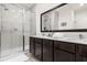 Bathroom features double sink, modern cabinetry, and a large glass-enclosed shower at 2634 Corvette Ln, Kissimmee, FL 34746