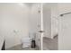 Half bathroom with tile floors, modern toilet, sink and white decor at 2634 Corvette Ln, Kissimmee, FL 34746