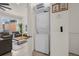 Laundry closet with stacked washer and dryer, shelving, and modern design at 2634 Corvette Ln, Kissimmee, FL 34746