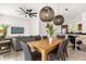 Inviting living and dining area with modern lighting, comfortable seating, and an open connection to the kitchen at 2634 Corvette Ln, Kissimmee, FL 34746