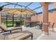 Spacious patio with lounge chairs, hot tub, grill, and outdoor dining under a shaded pergola at 2634 Corvette Ln, Kissimmee, FL 34746