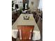 An open dining room showcases a long table with seating for eight at 2638 Eagle Canyon N Dr, Kissimmee, FL 34746