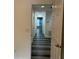 Hallway featuring wood-look flooring connecting different areas of the home at 2894 Tanzanite Ter, Kissimmee, FL 34758