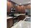 View of the kitchen with stainless steel appliances and a tiled backsplash at 2894 Tanzanite Ter, Kissimmee, FL 34758