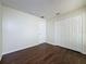 Bedroom with wood-look floors, large window and a closet at 2993 Kokomo Loop, Haines City, FL 33844