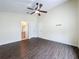 Bedroom with hardwood floors and an ensuite bathroom at 2993 Kokomo Loop, Haines City, FL 33844