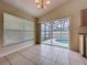 Dining area with a chandelier and sliding door views of the outdoor pool at 2993 Kokomo Loop, Haines City, FL 33844