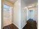 Hallway featuring wood-look floors and access to bathroom and other rooms at 2993 Kokomo Loop, Haines City, FL 33844