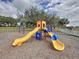 Playground with multiple slides and climbing structures, creating a fun and safe environment at 2993 Kokomo Loop, Haines City, FL 33844