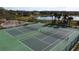 Aerial view of the well-maintained tennis courts and playground, perfect for active recreation at 2993 Kokomo Loop, Haines City, FL 33844