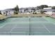 Up close aerial view of community tennis courts with building in background at 2993 Kokomo Loop, Haines City, FL 33844