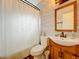 Bathroom featuring modern sink and vanity, toilet, and shower with curtain at 3004 Lake Margaret Dr, Orlando, FL 32806