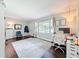 Well-lit living room featuring hardwood floors, modern furnishings, and a large window at 3004 Lake Margaret Dr, Orlando, FL 32806