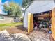 Exterior view of the shed, great for storage and has an easy access to the backyard and beautiful landscaping at 3004 Lake Margaret Dr, Orlando, FL 32806