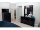 Bedroom with dark dresser, walk in closet and neutral walls at 318 Elderberry Ct, Kissimmee, FL 34759