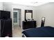 Bedroom with tile flooring, dark furniture, and a walk-in closet is visible at 318 Elderberry Ct, Kissimmee, FL 34759