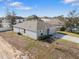 Aerial view of a gray house with a gray garage door and gray trim at 408 Danube Dr, Poinciana, FL 34759