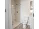 Bathroom with a shower stall, neutral tile flooring, and a single sink vanity at 408 Danube Dr, Poinciana, FL 34759