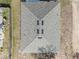 Aerial view of a shingled roof with skylights on a single-Gathering home at 408 Danube Dr, Poinciana, FL 34759