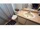 Functional bathroom with a white toilet, a sink with a vanity, and a shower curtain at 414 Otter Creek Dr, Kissimmee, FL 34743