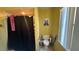 Bathroom features a toilet, shower with curtain, and a window allowing natural light at 414 Otter Creek Dr, Kissimmee, FL 34743