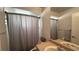 Bathroom with a sink, toilet, and a shower area, providing a clean and functional space at 414 Otter Creek Dr, Kissimmee, FL 34743