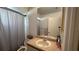 Practical bathroom with a shower, toilet, and a vanity, offering all essential amenities at 414 Otter Creek Dr, Kissimmee, FL 34743