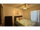 Bright bedroom with a ceiling fan, closet, and a large window at 414 Otter Creek Dr, Kissimmee, FL 34743